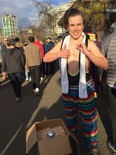 Ezra Tolzmann and his family drove up from Oregon for their sixth Polar Bear Swim in Vancouver on Wednesday, Jan. 1, 2020. The 17-year-old was handing out wooden knobs his friend Shawn Mick made to commemorate the swim's 100th anniversary.