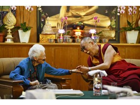 Vancouver eco-theologian Sallie McFague in dialogue with the Dalai Lama in India in 2011. Her student says McFague "spent her life working to articulate theologies that offered new insight and hope to the economic, social and environmental ills of our time."