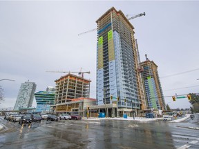 Highrise condos at the corner of Fraser Highway and Whalley Boulevard in Surrey on Jan. 16. Thousands of residential units are due to be completed in the next two years in the city.
