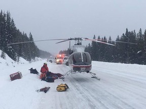 Pictured is Alpine Helicopters' Canmore rescue helicopter responding to a call for help after a woman was caught in an avalanche near Mount Hector, north of Lake Louise.