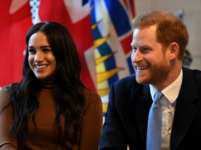 Britain's Prince Harry and his wife Meghan, Duchess of Sussex, at Canada House in London, England.