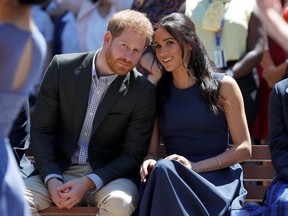 FILE PHOTO: Britain's Prince Harry and his wife Meghan, Duchess of Sussex, watch a performance during their visit to Macarthur Girls High School in Sydney, Australia October 19, 2018.