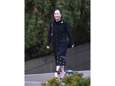 Huawei chief financial officer Meng Wanzhou leaves her Vancouver home to begin her extradition hearing in British Columbia Supreme Court, on January 20, 2020 in Vancouver, British Colombia. - The chief financial officer of China's Huawei arrived Monday morning at a Canadian court for the start of a hearing for her extradition to the United States. Meng Wanzhou wore a black dress that exposed an electronic ankle bracelet that authorities ordered her to wear as a condition of her release from custody. She made no comment on entering the court. (Photo by Don MacKinnon / AFP)