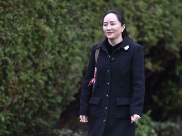 Huawei chief financial officer Meng Wanzhou leaves her Vancouver home to begin her extradition hearing in British Columbia Supreme Court, on January 20, 2020 in Vancouver, British Colombia. - The chief financial officer of China's Huawei arrived Monday morning at a Canadian court for the start of a hearing for her extradition to the United States. Meng Wanzhou wore a black dress that exposed an electronic ankle bracelet that authorities ordered her to wear as a condition of her release from custody. She made no comment on entering the court. (Photo by Don MacKinnon / AFP)