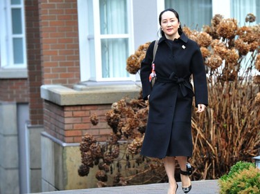 Huawei chief financial officer Meng Wanzhou leaves her Vancouver home for an extradition hearing in British Columbia Supreme Court, on January 21, 2020 in Vancouver, British Colombia. - The Chinese telecommunications executive whose arrest in Vancouver badly strained Canada-China relations went to court on Monday to fight extradition to the United States, with her lawyers calling the accusations against her "fiction." Meng Wanzhou, the chief financial officer of tech giant Huawei and eldest daughter of its founder Ren Zhengfei, is wanted by US authorities for alleged fraud. (Photo by Don MacKinnon / AFP)
