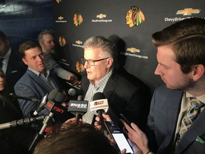 Assistant coach Marc Crawford of the Chicago Blackhawks speaks with reporters in Vancouver on Thursday about his recent suspension and past behaviours as an NHL coach.