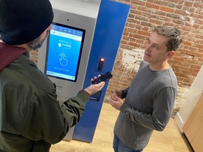 Dr. Mark Tyndall, a professor of medicine at UBC's School of Population and Public Health, displays the opioid vending machine in the Downtown Eastside.