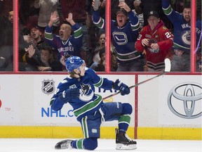 Adam Gaudette celebrates his game-winning goal Thursday in wild 7-5 decision over the Blackhawks.