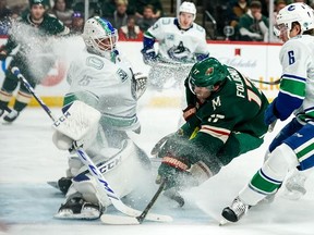 Minnesota Wild forward Marcus Foligno (17) scores a goal on Vancouver Canucks goalie Jacob Markstrom (25) during the second period.