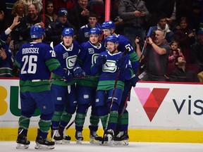 Vancouver Canucks' forward Jake Virtanen, shown celebrating his goal against the Los Angeles Kings on Dec. 28, is one of the players GM Jim Benning hopes will lead the NHL team to the playoffs this season.