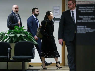 VANCOUVER, BC - JANUARY 20: Huawei Technologies Chief Financial Officer Meng Wanzhou is escorted by her security personnel as she leaves court during a break for lunch on the first day of her extradition trial on January 20, 2020 in Vancouver, Canada. The United States government accused Wanzhou of fraud after HSBC continued trade with Iran while sanctions were in place.