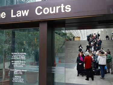 VANCOUVER, BC - JANUARY 20:  Members of the media and public line up outside a British Columbia Supreme courtroom on the first day of the extradition trial for Huawei Technologies Chief Financial Officer Meng Wanzhou on January 20, 2020 in Vancouver, Canada. The United States government accused Wanzhou of fraud after HSBC continued trade with Iran while sanctions were in place.