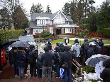 VANCOUVER, BC - JANUARY 20: Members of the media stand outside the home of Huawei Technologies Chief Financial Officer Meng Wanzhou as they wait for her to leave for a court appearance on the first day of her extradition trial on January 20, 2020 in Vancouver, Canada. The United States government accused Wanzhou of fraud after HSBC continued trade with Iran while sanctions were in place.