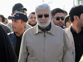 Abu Mahdi al-Muhandis, a commander in the Popular Mobilization Forces attend a funeral procession of Hashd al-Shaabi (paramilitary forces) members, who were killed by U.S. air strikes in Qaim district, at the Green zone in Baghdad, Iraq December 31, 2019.