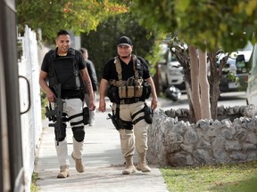 Policemen patrol the perimeter of a private school after a boy shot a teacher and wounded several students, in Torreon, Mexico January 10, 2020.