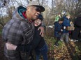 Friends of homicide victim Jesus Cristobal-Esteban mourn his passing during a vigil at the Cottonwood Community Garden in Vancouver on Saturday, Jan. 4. Cristobal-Esteban was assaulted at Oppenheimer Park on New Year's Day and died a day later. Police are still investigating his death.