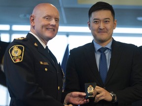 Recruit Alex Zhou, who grew-up in China, with Chief Constable Adam Palmer.