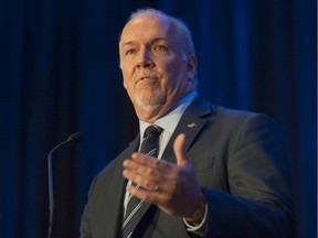B.C. Premier John Horgan speaks at the leader's luncheon during the annual Truck Loggers Association convention in Vancouver on Jan. 16.