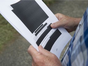 Former NDP MLA David Chudnovsky with a copy of a heavily redacted contract between BC Housing and Holborn Properties, that he received via an FOI request. The contract covers the sale of the Little Mountain property.