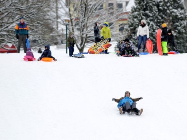 Children enjoy a snow day at Kensington Park as the Lower Mainland is under an extreme weather warning with most schools closed and people advised to stay home if possible in Vancouver, BC., January 15, 2020.