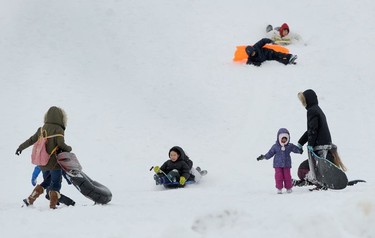 Children enjoy a snow day at Kensington Park as the Lower Mainland is under an extreme weather warning with most schools closed and people advised to stay home if possible in Vancouver, BC., January 15, 2020.