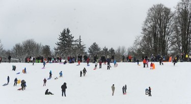 Children enjoy a snow day at Kensington Park as the Lower Mainland is under an extreme weather warning with most schools closed and people advised to stay home if possible in Vancouver, BC., January 15, 2020.