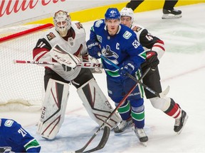 VANCOUVER, BC - January 16, 2020 - Vancouver Canucks Bo Horvat skates in front of Arizona Coyotes goalie Adin Hall and Ilya Lyubushkin duing NHL action at Rogers Arena in Vancouver, BC, January 16, 2020. (Arlen Redekop / PNG staff photo) (story by reporter) [PNG Merlin Archive]