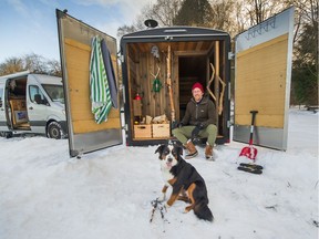 Valtteri Rantala and his dog Nala at his mobile Finnish sauna at Spanish Banks in Vancouver.