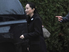 Huawei executive Meng Wanzhou leaves her home for the first day of her extradition hearing in Vancouver, BC., January 20, 2020.