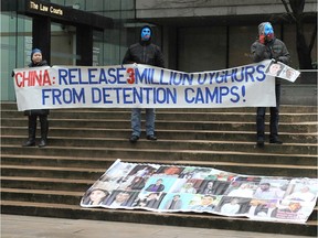 Demonstrators outside B.C. Supreme Court as the extradition hearing for Huawei executive Meng Wanzhou begins in Vancouver on January 20, 2020.