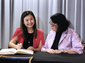 Anne Kang, left, Minister of Citizen's Services  at a swearing in ceremony  for change in ministerial responsibilities.