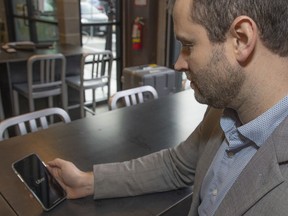 Michael van Hemmen, head of Western Canada for Uber, illustrates the app.