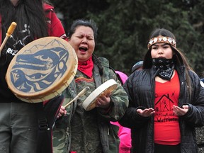 Metro Vancouver students plan to stage a walkout on Monday in support of the Wet'suwet'en Nation who are pushing back against the Coastal GasLink pipeline. In this file photo, Ta'Kaiya, front, and Sii-am Hamilton, holding a sign, are seen standing with Indigenous youth demonstrating support for the Wet'suwet'en hereditary chiefs in northwest B.C. opposing the LNG pipeline project, in front of the B.C. legislature in Victoria on Friday, Jan. 24, 2020.