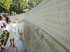 Relatives attend a memorial at Ceperley Park in Vancouver to victims of the 1985 Air India bombing.