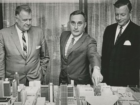 Left to right: Toronto Maple Leafs owners Harold Ballard and Stafford Smythe show the design of their proposed downtown hockey arena to the Vancouver media on Aug. 19, 1964. Vancouver Mayor Bill Rathie (right) supported the plan, which would have seen a 20,000 arena built on West Georgia where the CBC and Vancouver Public Library are today.