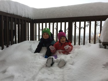 Reed, 8, and Elizabeth, 3 Salo play in the snow Wednesday in the Heritage Mountain neighbourhood in Port Moody, BC. Schools in the region are closed because of a heavy snowfall. [PNG Merlin Archive]