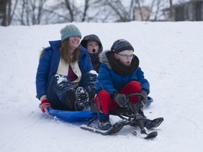 The Boersmas — mom Karen and sons Theo and Andrew (in red pants) — have fun sledding in Beaconsfield Park in Vancouver on Monday, Jan. 13, 2020.
