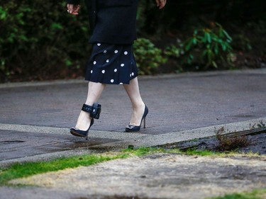 The ankle monitor of Huawei Chief Financial Officer Meng Wanzhou is visible as she leaves her home to attend the start of her extradition hearing at B.C. Supreme Court in Vancouver, British Columbia, Canada January 20, 2020.  REUTERS/Lindsey Wasson
