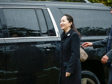 Huawei Chief Financial Officer Meng Wanzhou greets the media as she leaves her home to attend the start of her extradition hearing at B.C. Supreme Court in Vancouver, British Columbia, Canada January 20, 2020.  REUTERS/Lindsey Wasson