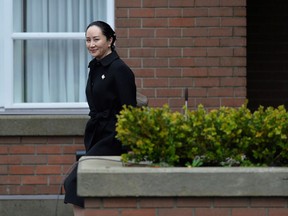 Huawei Chief Financial Officer Meng Wanzhou leaves her home to attend her extradition hearing at B.C. Supreme Court in Vancouver Wednesday.