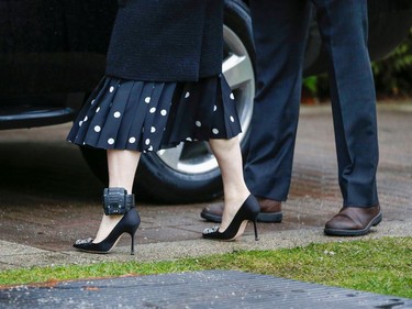 The ankle monitor of Huawei Chief Financial Officer Meng Wanzhou is visible as she leaves her home to attend the start of her extradition hearing at B.C. Supreme Court in Vancouver, British Columbia, Canada January 20, 2020.  REUTERS/Lindsey Wasson