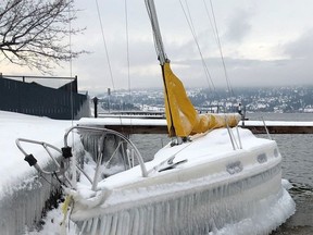 A sailboat encased in ice is shown in an RCMP handout photo. Mounties in West Kelowna, B.C., have released the photo of a sail boat covered in icicles in the hope that its owner might recognize the frozen vessel.