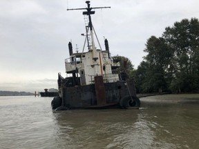 The MV Spudnik is shown in the Fraser River near Surrey, B.C. in a handout photo. Work has begun on the removal of an abandoned vessel near Surrey, B.C., that has been an eyesore on the Fraser River for over five years. THE CANADIAN PRESS/HO-Fisheries and Oceans Canada, Pacific Region MANDATORY CREDIT