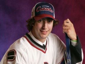 Tenth-overall draft pick Luc Bourdon of the Vancouver Canucks poses for a portrait during the 2005 NHL Draft on July 30, 2005, at the Westin Hotel in Ottawa.