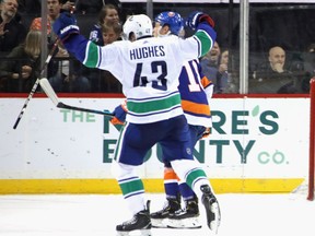 NEW YORK, NEW YORK - FEBRUARY 01: Quinn Hughes #43 of the Vancouver Canucks celebrates his game winning goal in overtime against the New York Islanders at the Barclays Center on February 01, 2020 in the Brooklyn borough of New York City. The Canucks defeated the Islanders 4-3 in overtime.