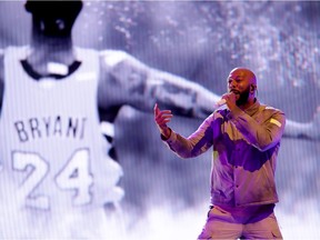 Common performs in front of a Kobe Bryant backdrop before the 69th NBA All-Star Game on Feb. 16 at the United Center in Chicago, Ill.