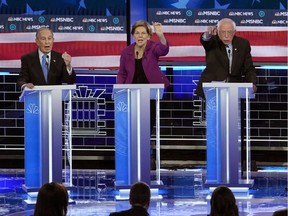 Former New York City Mayor Mike Bloomberg, Senator Elizabeth Warren, Senator Bernie Sanders and former Vice President Joe Biden (L-R) all speak simultaneously at the ninth Democratic 2020 U.S. Presidential candidates debate at the Paris Theater in Las Vegas, Nevada, U.S., February 19, 2020.