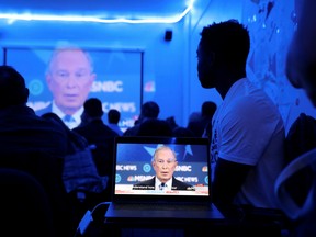 Supporters of Democratic presidential candidate Michael Bloomberg watch as he participates in the Democratic presidential debate from his campaign office in the Brooklyn borough of New York City, New York, U.S., February 19, 2020.