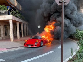 The classic car is seen ablaze.