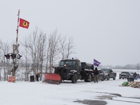 Members of the Mohawk Tyendinaga territory block the CN tracks in Tyendinaga, Ont. on Friday, Feb.7, 2020 in support of the Wet'suwet'en blockade of a natural gas pipeline in northern B.C.